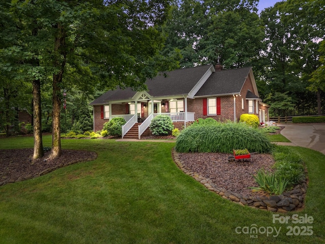 635 Timberlane Trl, Salisbury, NC 28147 - ranch-style home with brick siding, a porch, a front yard, concrete driveway, and a chimney
