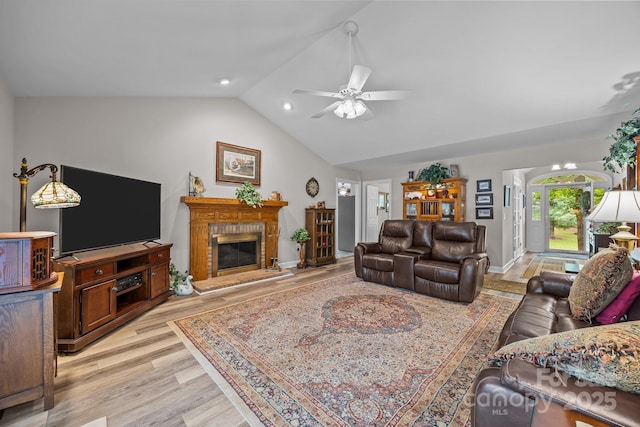 635 Timberlane Trl, Salisbury, NC 28147 - living area with vaulted ceiling, light wood-style floors, a ceiling fan, a brick fireplace, and baseboards