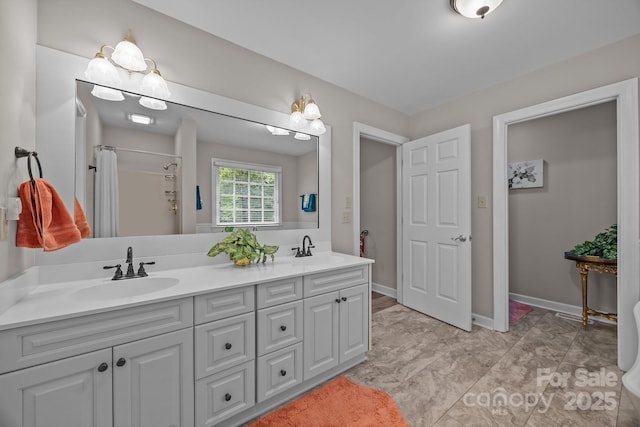 635 Timberlane Trl, Salisbury, NC 28147 - bathroom featuring double vanity, a shower with shower curtain, and baseboards
