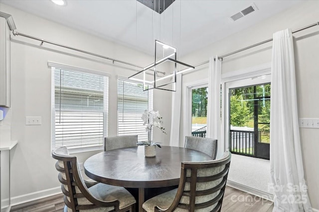 9009 Myrna Dr, Gastonia, NC 28056 - dining area with wood finished floors and a chandelier
