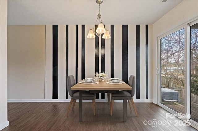 31 English Ivy Rd, Asheville, NC 28806 - dining space with wood finished floors, baseboards, and a chandelier