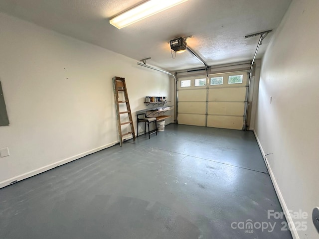 31 English Ivy Rd, Asheville, NC 28806 - garage featuring baseboards and a garage door opener