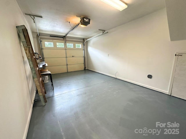 31 English Ivy Rd, Asheville, NC 28806 - garage featuring a garage door opener and baseboards
