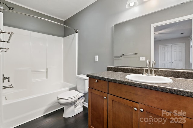 31 English Ivy Rd, Asheville, NC 28806 - bathroom featuring toilet, vanity, shower / washtub combination, wood finished floors, and crown molding
