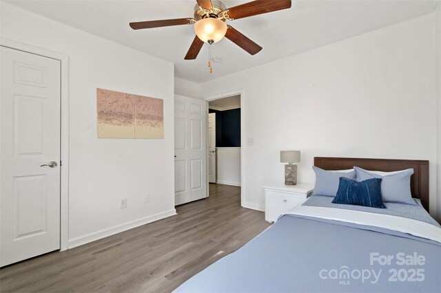 31 English Ivy Rd, Asheville, NC 28806 - bedroom with wood finished floors, baseboards, and a ceiling fan
