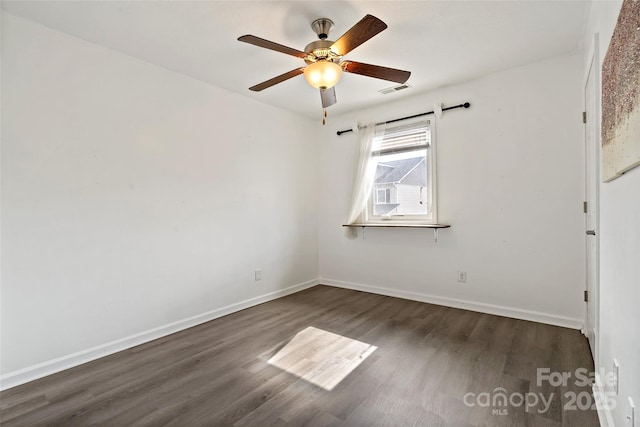 31 English Ivy Rd, Asheville, NC 28806 - unfurnished room featuring dark wood-style flooring, a ceiling fan, and baseboards