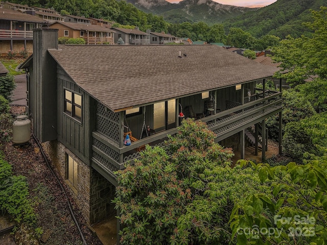 418 Stoney Ridge Loop, Maggie Valley, NC 28751 - back of property featuring roof with shingles, board and batten siding, stairway, and a mountain view