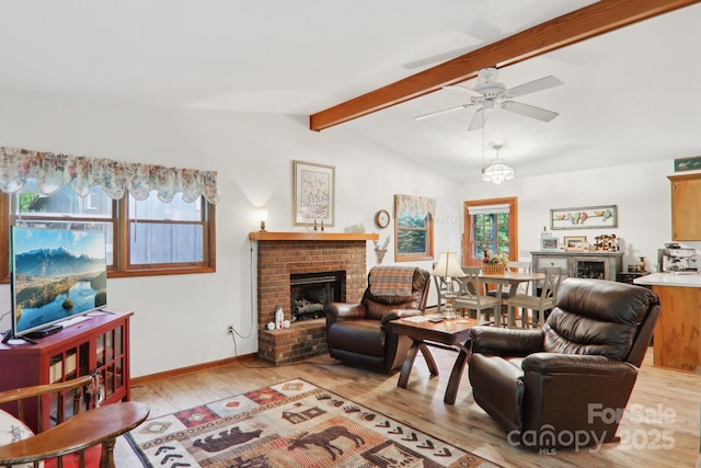 418 Stoney Ridge Loop, Maggie Valley, NC 28751 - living area featuring a brick fireplace, light wood-type flooring, ceiling fan, and baseboards