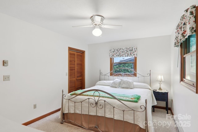 418 Stoney Ridge Loop, Maggie Valley, NC 28751 - bedroom featuring carpet floors, a closet, baseboards, and ceiling fan