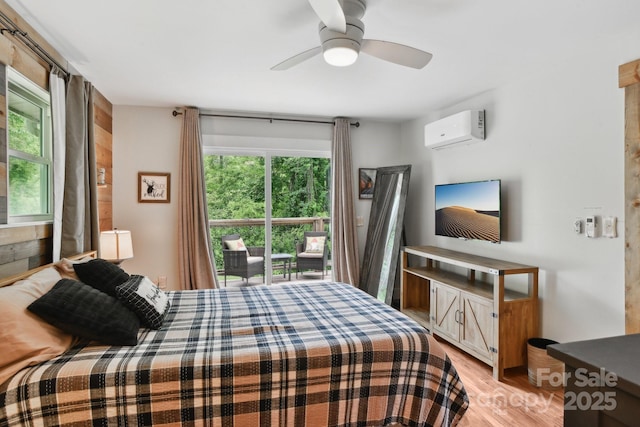 72 Wakulla Dr, Maggie Valley, NC 28751 - bedroom with a wall unit AC, light wood-type flooring, and a ceiling fan