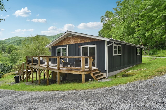 72 Wakulla Dr, Maggie Valley, NC 28751 - view of front of home featuring a deck with mountain view and board and batten siding