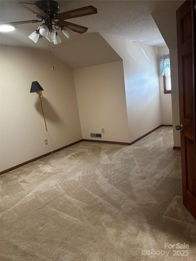 550 Camrose Cir NE, Concord, NC 28025 - additional living space with ceiling fan, light carpet, and baseboards