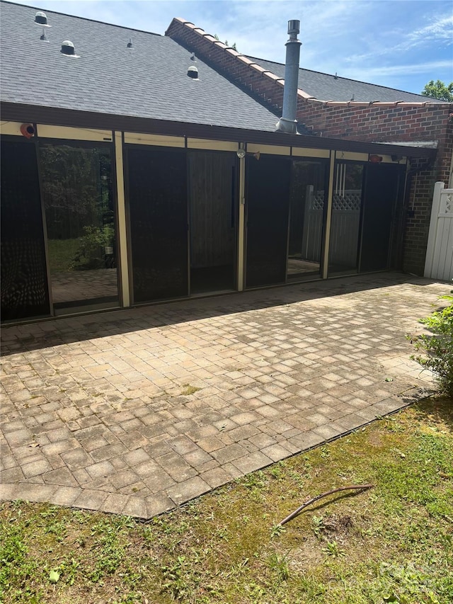 550 Camrose Cir NE, Concord, NC 28025 - back of property featuring a patio, roof with shingles, and brick siding