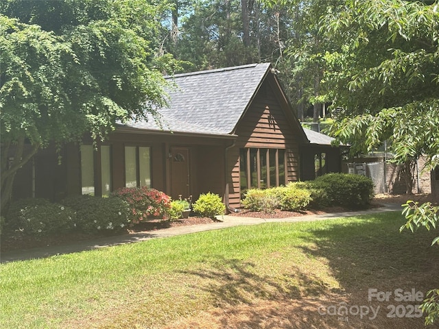 550 Camrose Cir NE, Concord, NC 28025 - view of front of house featuring a front yard and a shingled roof