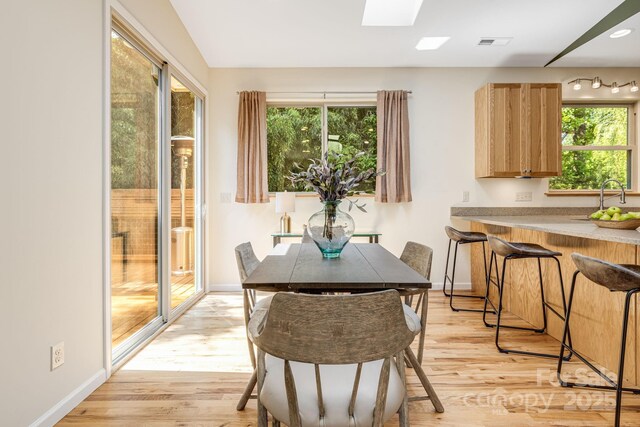 506 Hiawassee Ave, Black Mountain, NC 28711 - dining area featuring healthy amount of natural light, light wood-style floors, and baseboards