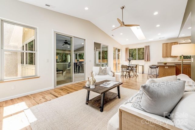 506 Hiawassee Ave, Black Mountain, NC 28711 - living area with a ceiling fan, light wood finished floors, lofted ceiling, a skylight, and recessed lighting