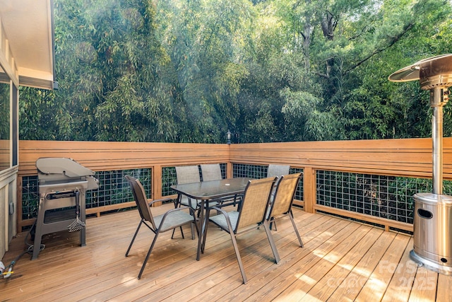 506 Hiawassee Ave, Black Mountain, NC 28711 - wooden deck with outdoor dining area, area for grilling, and a forest view