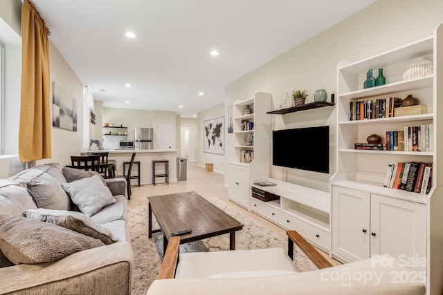 506 Hiawassee Ave, Black Mountain, NC 28711 - living room featuring light wood finished floors, recessed lighting, and built in features