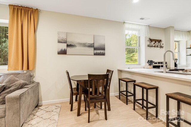506 Hiawassee Ave, Black Mountain, NC 28711 - dining room featuring light wood-style floors, recessed lighting, and baseboards