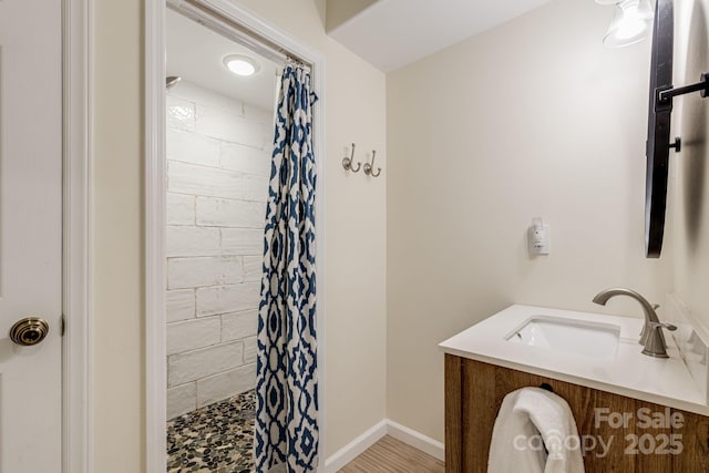 506 Hiawassee Ave, Black Mountain, NC 28711 - bathroom featuring tiled shower, vanity, and baseboards
