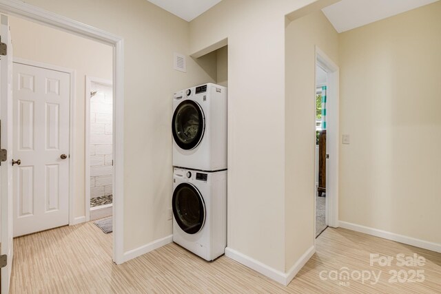 506 Hiawassee Ave, Black Mountain, NC 28711 - laundry room with stacked washer and clothes dryer and baseboards