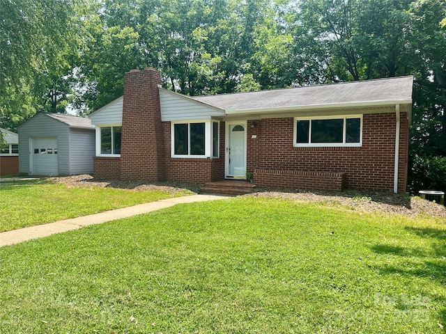 117 Silvercreek Rd, Morganton, NC 28655 - ranch-style house featuring a chimney, brick siding, a front lawn, central AC, and a garage
