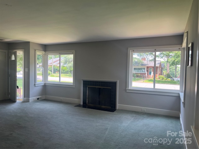 117 Silvercreek Rd, Morganton, NC 28655 - unfurnished living room featuring carpet flooring, plenty of natural light, and baseboards