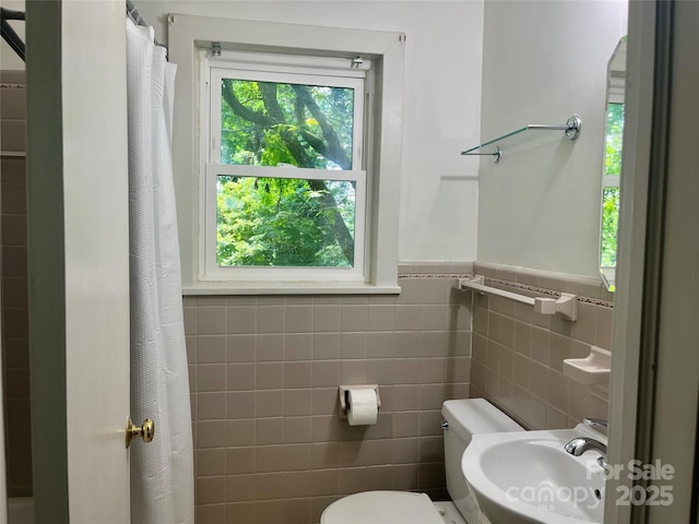 117 Silvercreek Rd, Morganton, NC 28655 - full bath with a sink, toilet, a shower with shower curtain, tile walls, and a wainscoted wall