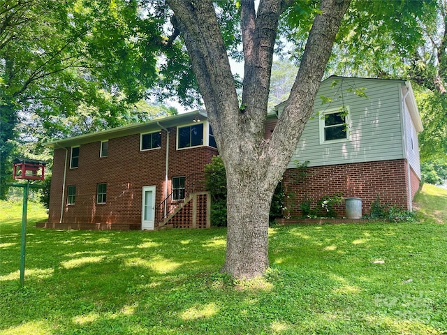 117 Silvercreek Rd, Morganton, NC 28655 - rear view of property featuring brick siding, a yard, and stairway