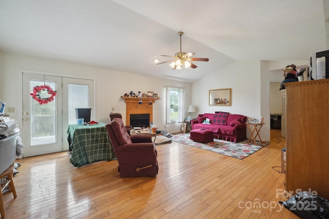 1670 Jamestown Rd, Morganton, NC 28655 - living area featuring light wood-type flooring, ceiling fan, vaulted ceiling, and a fireplace