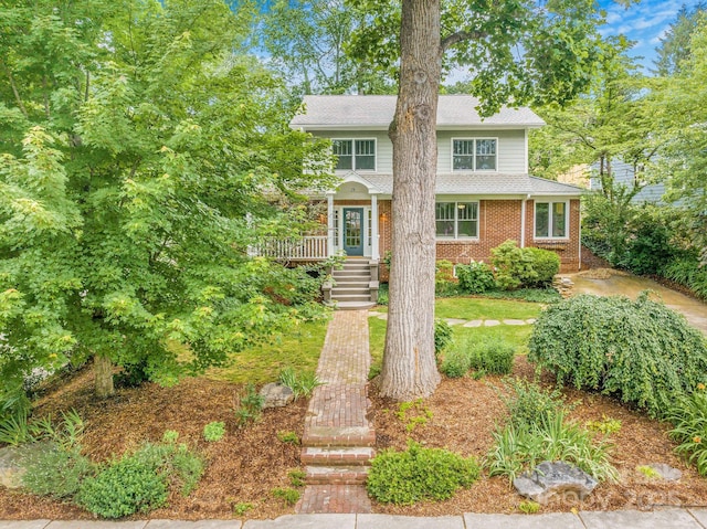 24 Warwick Rd, Asheville, NC 28803 - view of front of house featuring stairs, brick siding, a shingled roof, and a deck