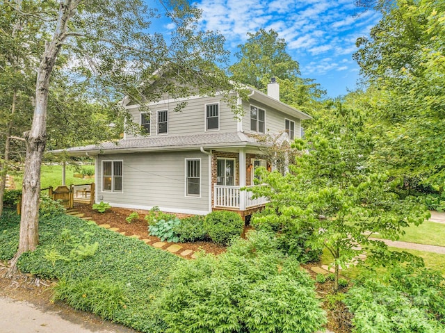 24 Warwick Rd, Asheville, NC 28803 - view of side of property with a chimney and a porch