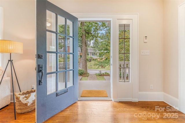 24 Warwick Rd, Asheville, NC 28803 - doorway to outside with wood finished floors and baseboards