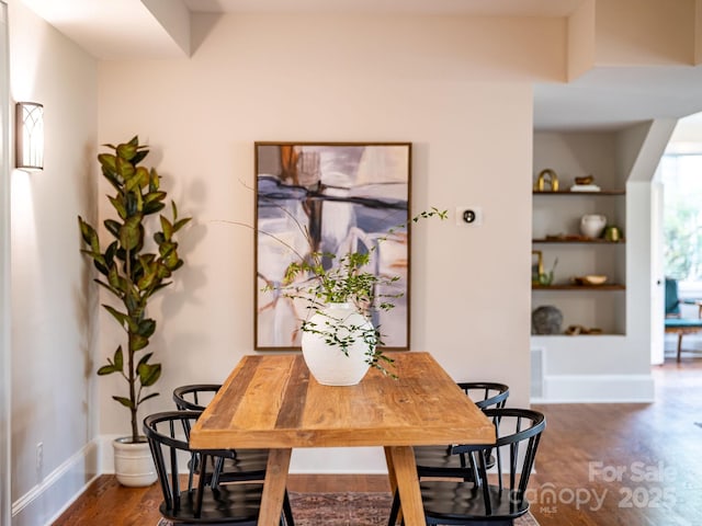 24 Warwick Rd, Asheville, NC 28803 - dining area featuring dark wood-style floors and baseboards