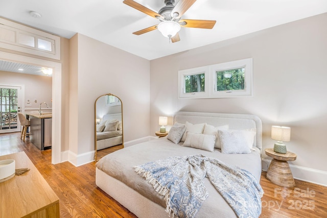 24 Warwick Rd, Asheville, NC 28803 - bedroom with wood finished floors, baseboards, and a ceiling fan