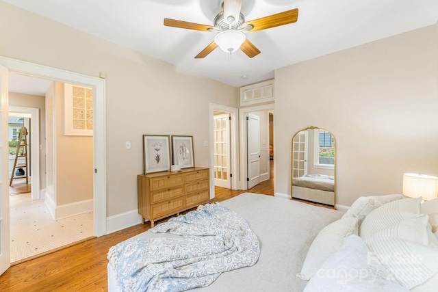 24 Warwick Rd, Asheville, NC 28803 - bedroom with light wood-style floors, baseboards, and ceiling fan