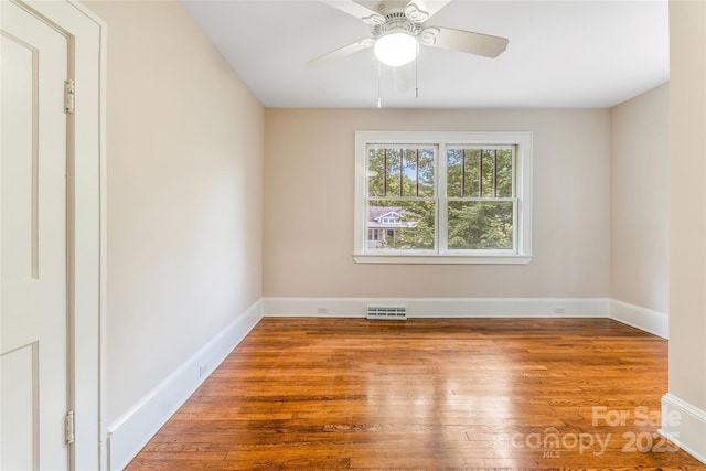 24 Warwick Rd, Asheville, NC 28803 - empty room featuring hardwood / wood-style flooring, baseboards, and a ceiling fan