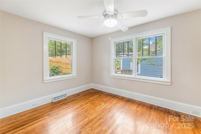 24 Warwick Rd, Asheville, NC 28803 - unfurnished room featuring hardwood / wood-style flooring, baseboards, and ceiling fan