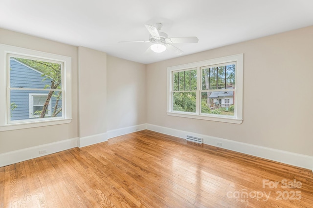 24 Warwick Rd, Asheville, NC 28803 - unfurnished room featuring light wood-type flooring, baseboards, and ceiling fan