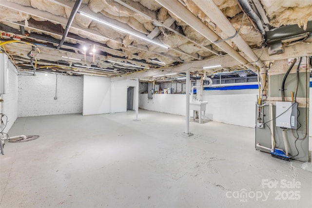 24 Warwick Rd, Asheville, NC 28803 - unfinished below grade area with electric panel and a sink