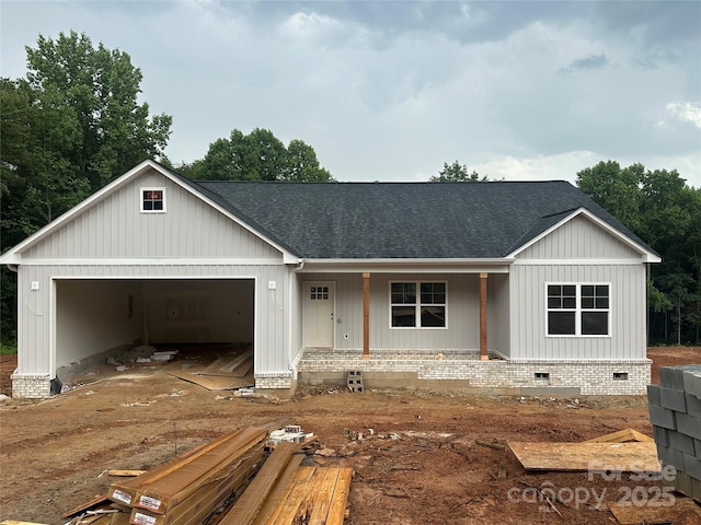 63 Cornerstone Dr, Taylorsville, NC 28681 - view of front of home with a shingled roof, an attached garage, crawl space, and covered porch
