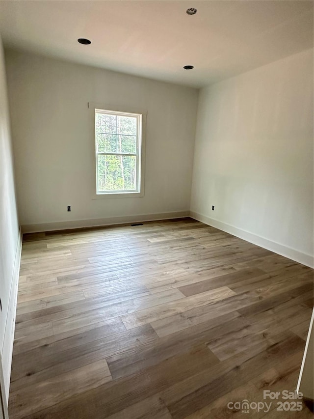 63 Cornerstone Dr, Taylorsville, NC 28681 - unfurnished room with wood finished floors, baseboards, and recessed lighting