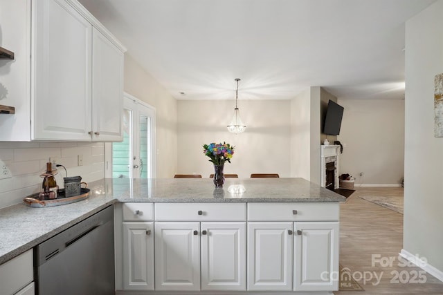7931 Baylis Dr, Huntersville, NC 28078 - kitchen with dishwasher, a peninsula, light wood-style flooring, white cabinets, and baseboards