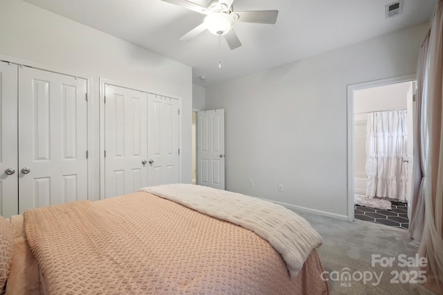 7931 Baylis Dr, Huntersville, NC 28078 - carpeted bedroom with two closets, baseboards, ensuite bathroom, and ceiling fan