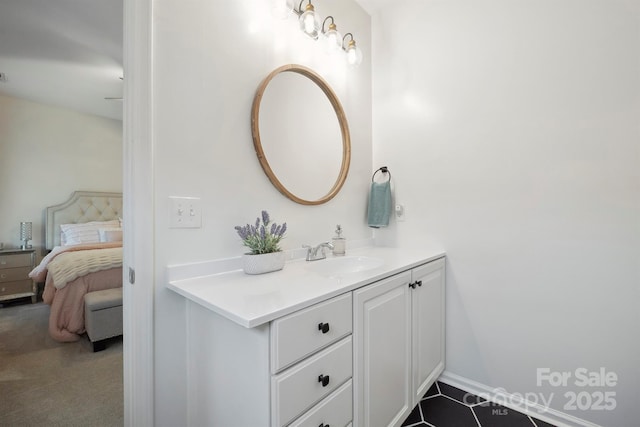 7931 Baylis Dr, Huntersville, NC 28078 - bathroom featuring vanity, ensuite bathroom, and baseboards