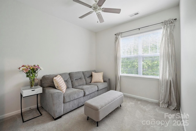 7931 Baylis Dr, Huntersville, NC 28078 - living area with light carpet, baseboards, and ceiling fan