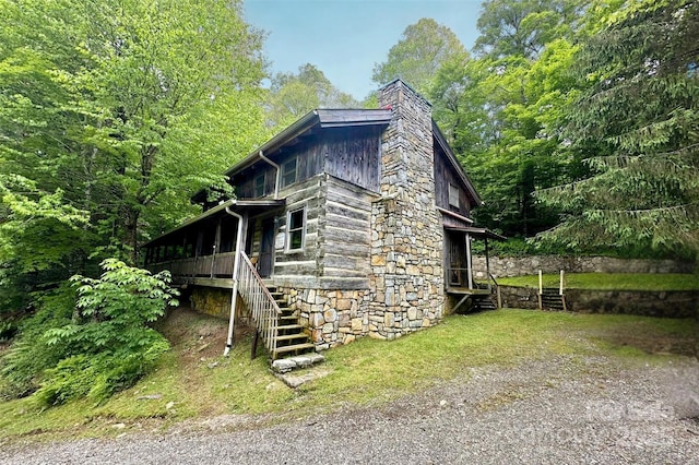 1495 El Miner Dr, Mars Hill, NC 28754 - view of side of home with stairs, a chimney, and stone siding