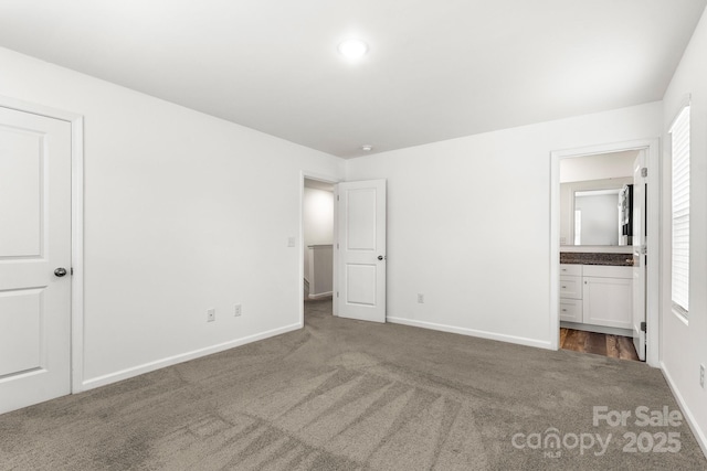 1112 Angle St, Cherryville, NC 28021 - unfurnished bedroom with carpet flooring, baseboards, and connected bathroom