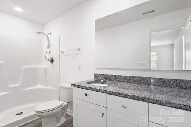 1112 Angle St, Cherryville, NC 28021 - bathroom featuring vanity, wood finished floors, toilet, and a shower