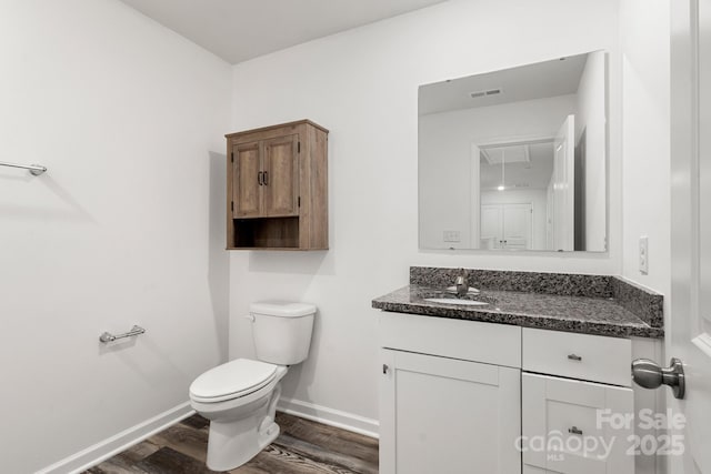 1112 Angle St, Cherryville, NC 28021 - half bath with wood finished floors, toilet, vanity, and baseboards